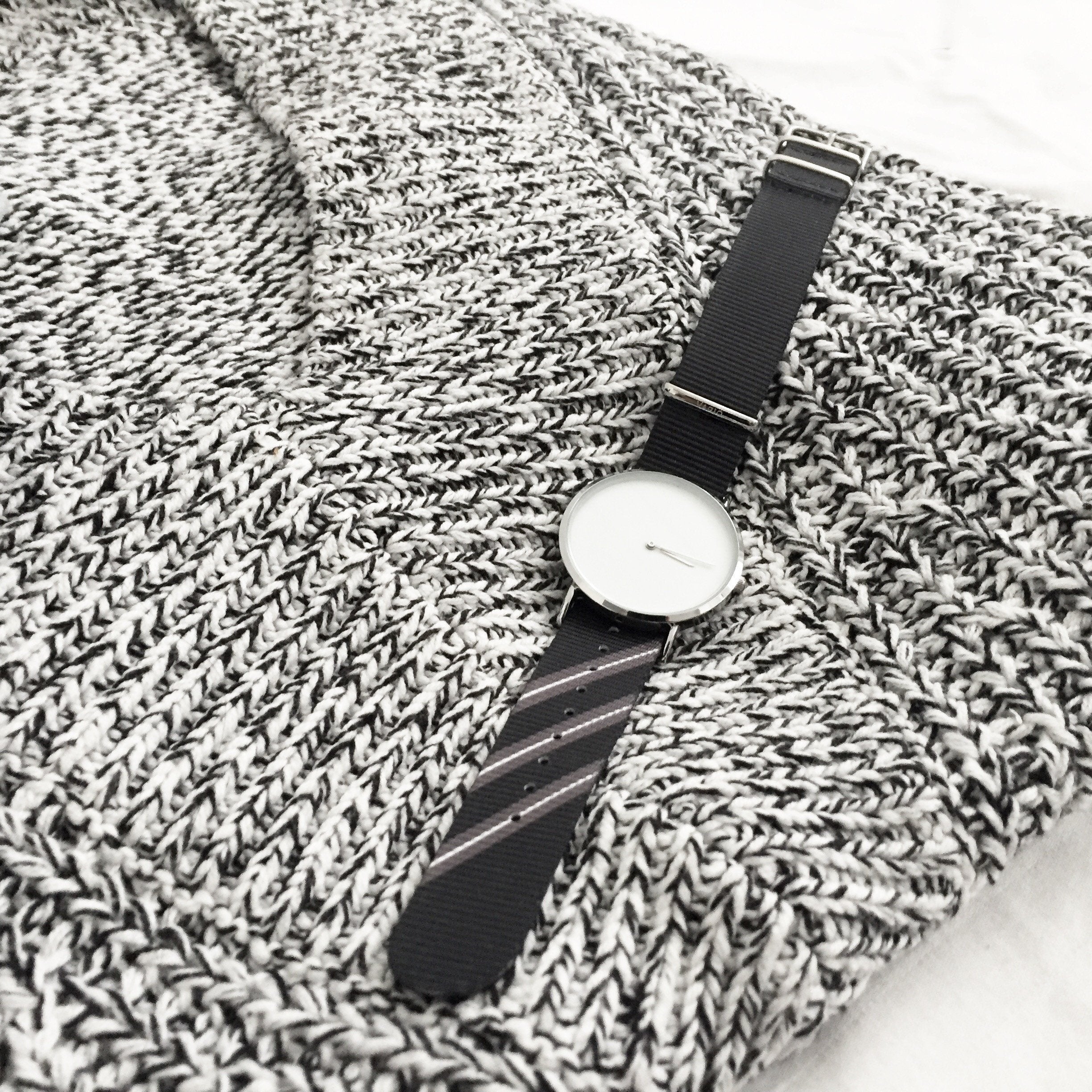 Black Razor Strap on Black and White Sweater