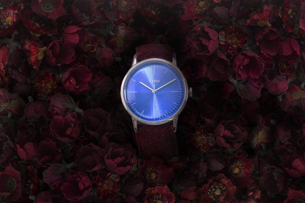 Eclipse Topaz Dress Watch surrounded by Red Roses